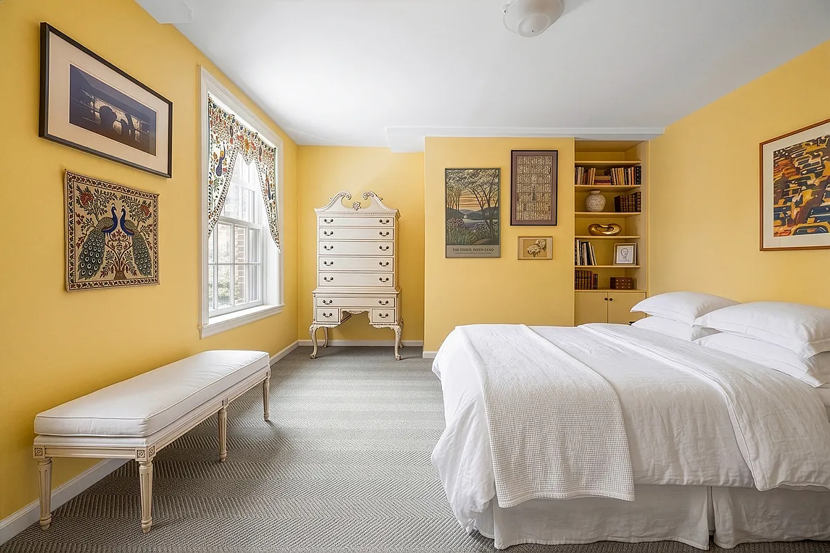 bedroom with carpeted floor, yellow walls