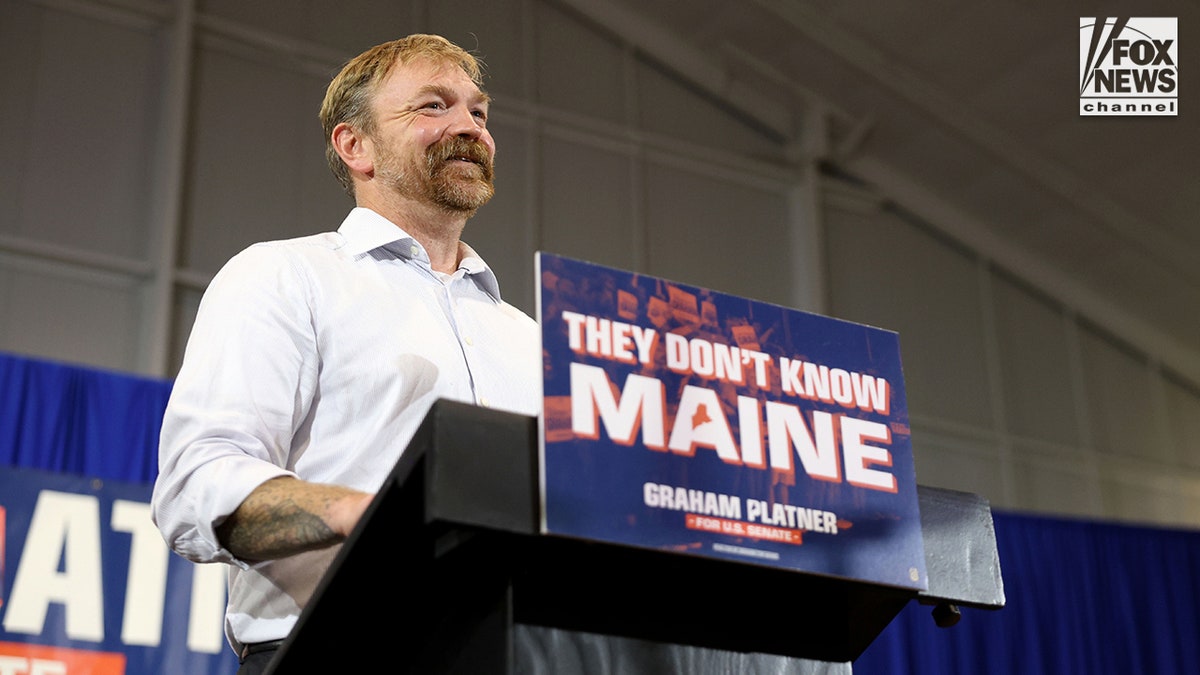 Graham Platner speaking to a crowd at a YMCA in Blue Hill, Maine