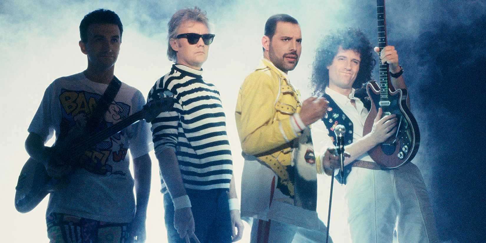 The band Queen (John Deacon, Roger Taylor, Freddie Mercury, Brian May)
