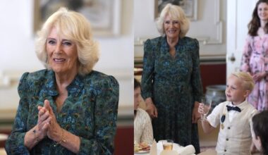 Queen Camilla wears a peacock print dress for a treasure hunt and tea party for children supported by Dreams and Wishes at Clarence House on Wednesday in London.