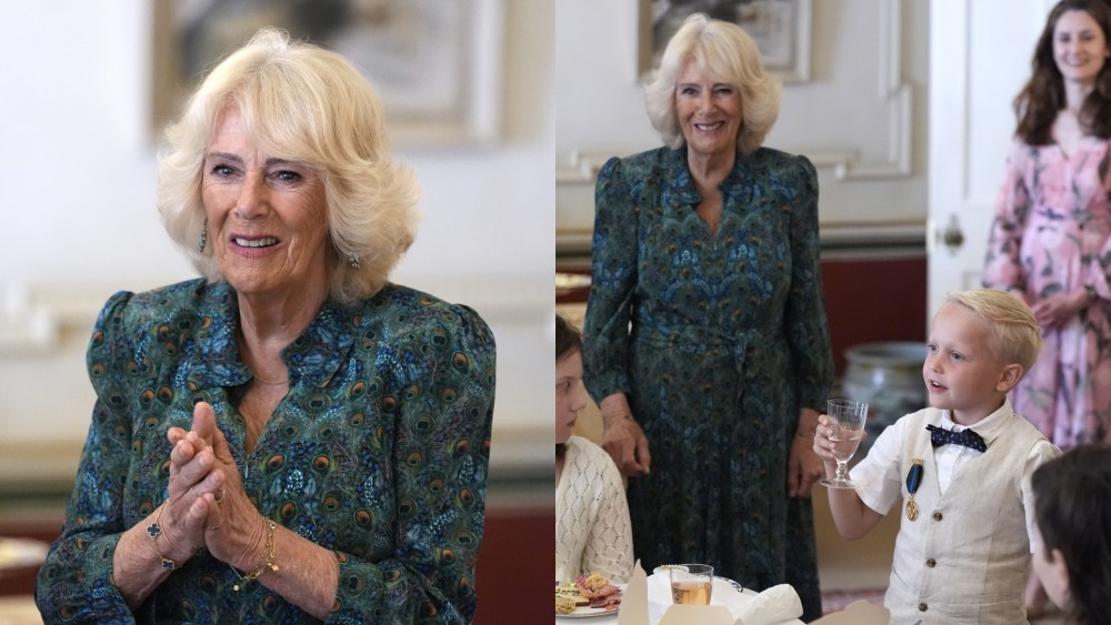 Queen Camilla wears a peacock print dress for a treasure hunt and tea party for children supported by Dreams and Wishes at Clarence House on Wednesday in London.