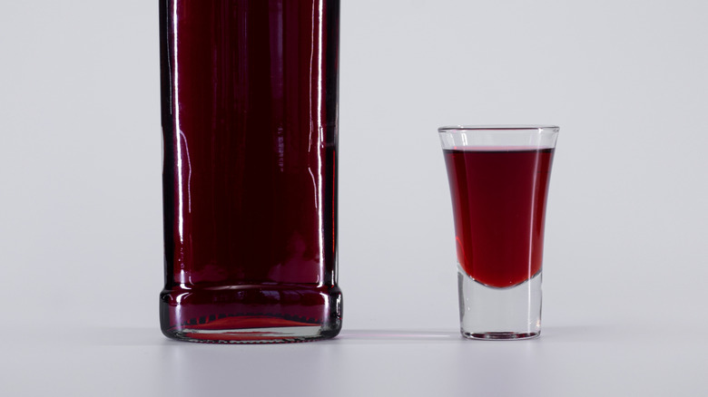 Shot glass filled with sweet red vermouth