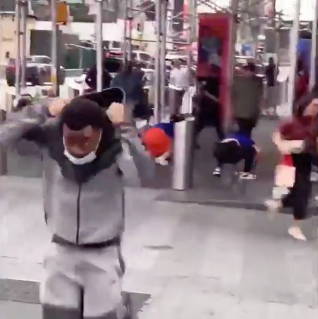 People in New York Knicks jerseys fleeing a shooting in Times Square.