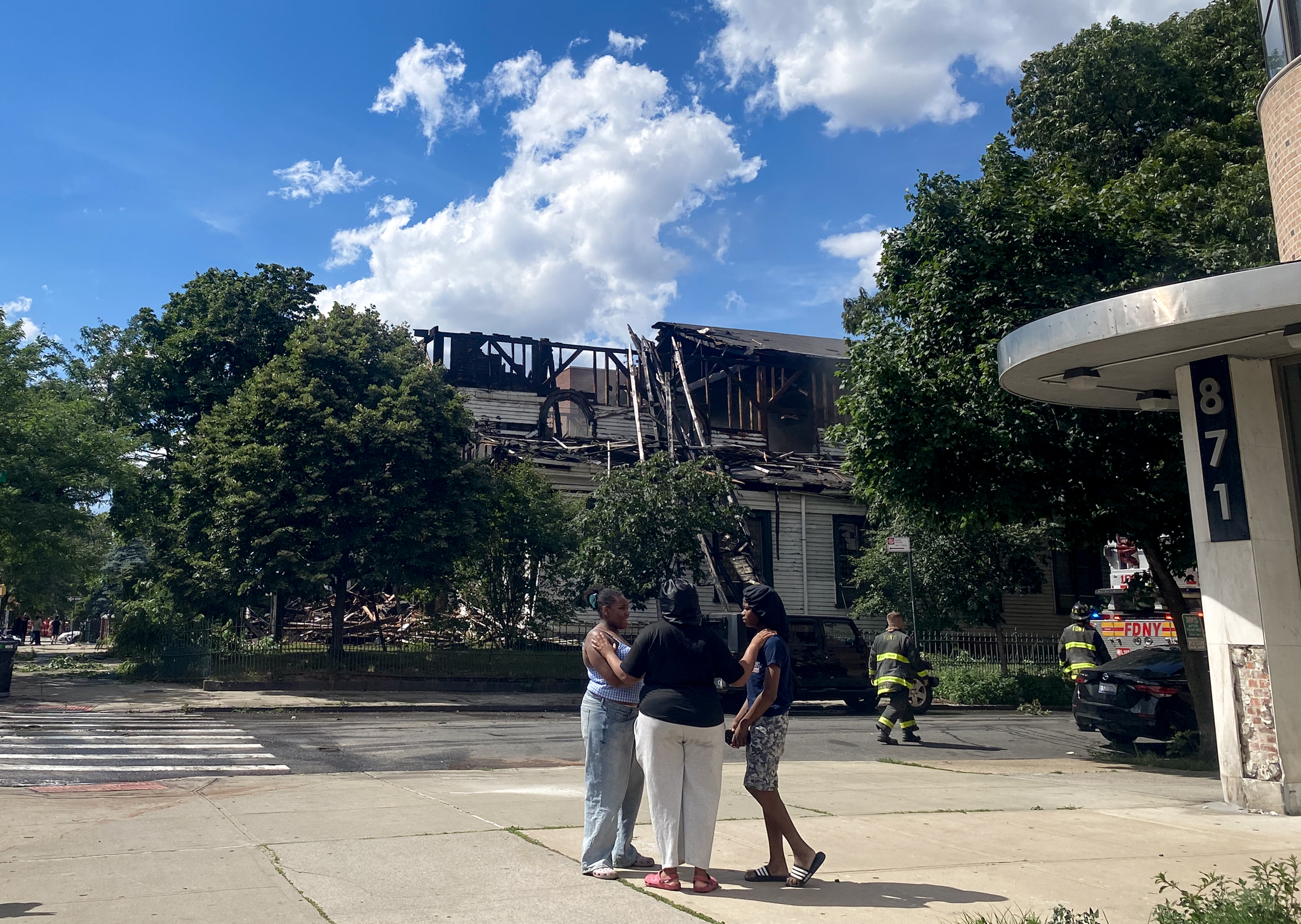 people in front of the burned church