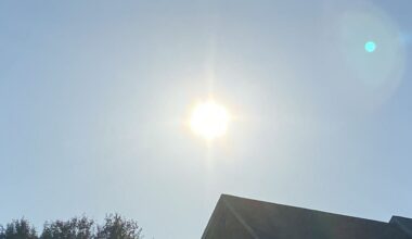 the sun shines down from a clear sky