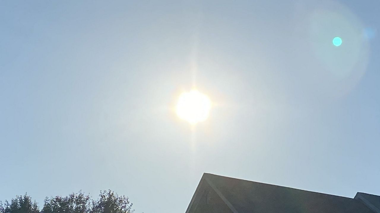 the sun shines down from a clear sky