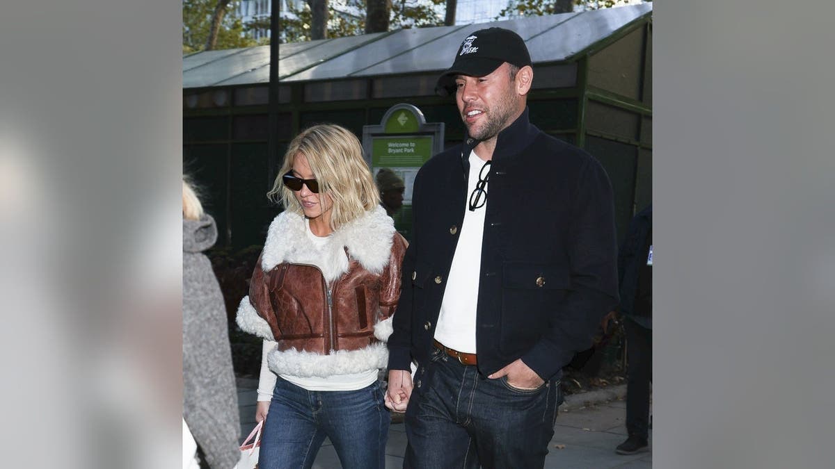 Sydney Sweeney and Scooter Braun standing together in Bryant Park New York City