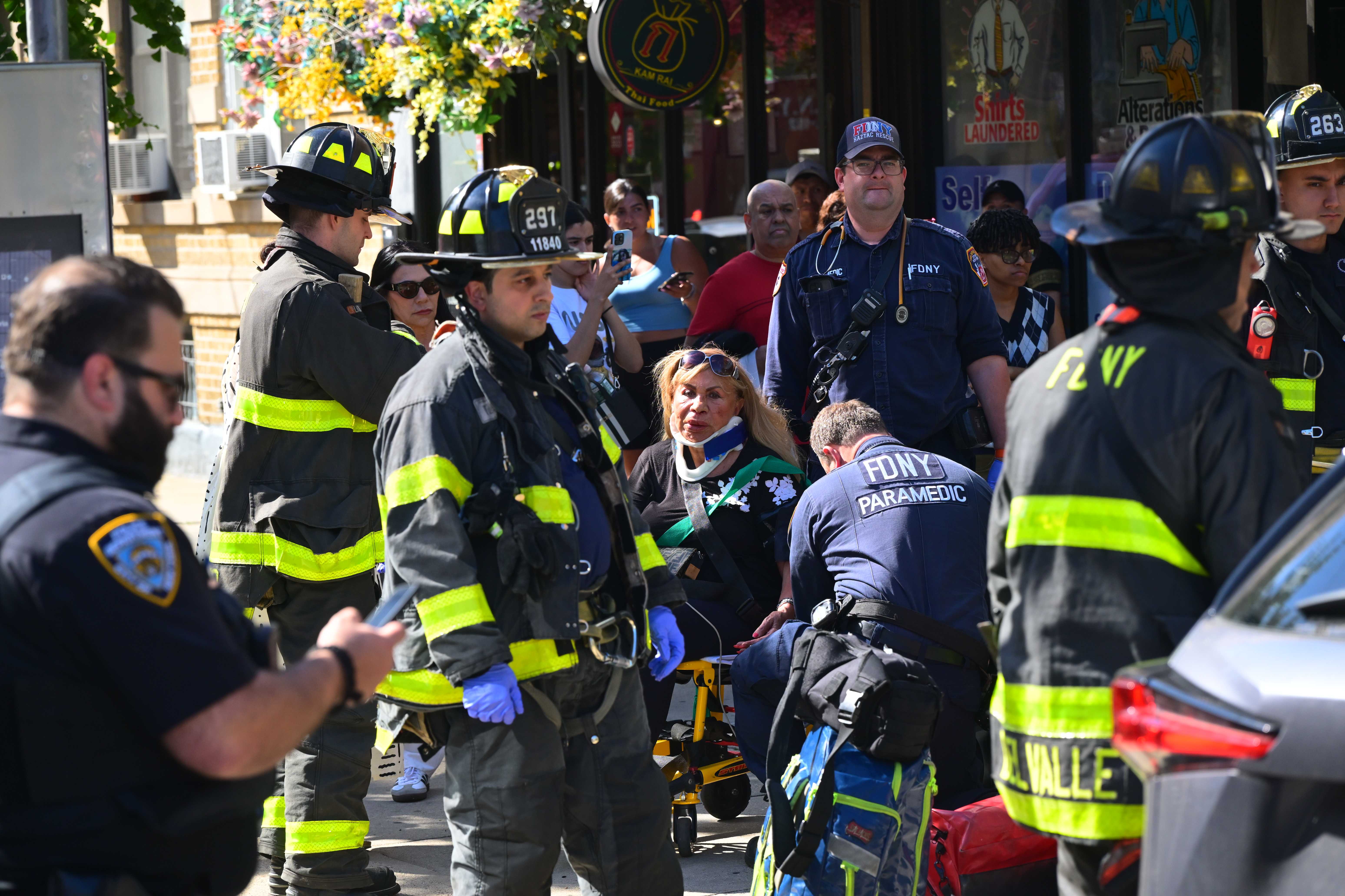 Firefighters and EMS responded to the scene and the elderly driver and two pedestrians were transported to Elmhurst Hospital in stable condition. 