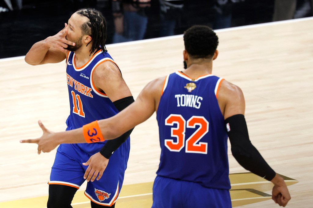 Jalen Brunson #11 of the New York Knicks celebrates after his three-point basket against the San Antonio Spurs with Karl-Anthony Towns #32.