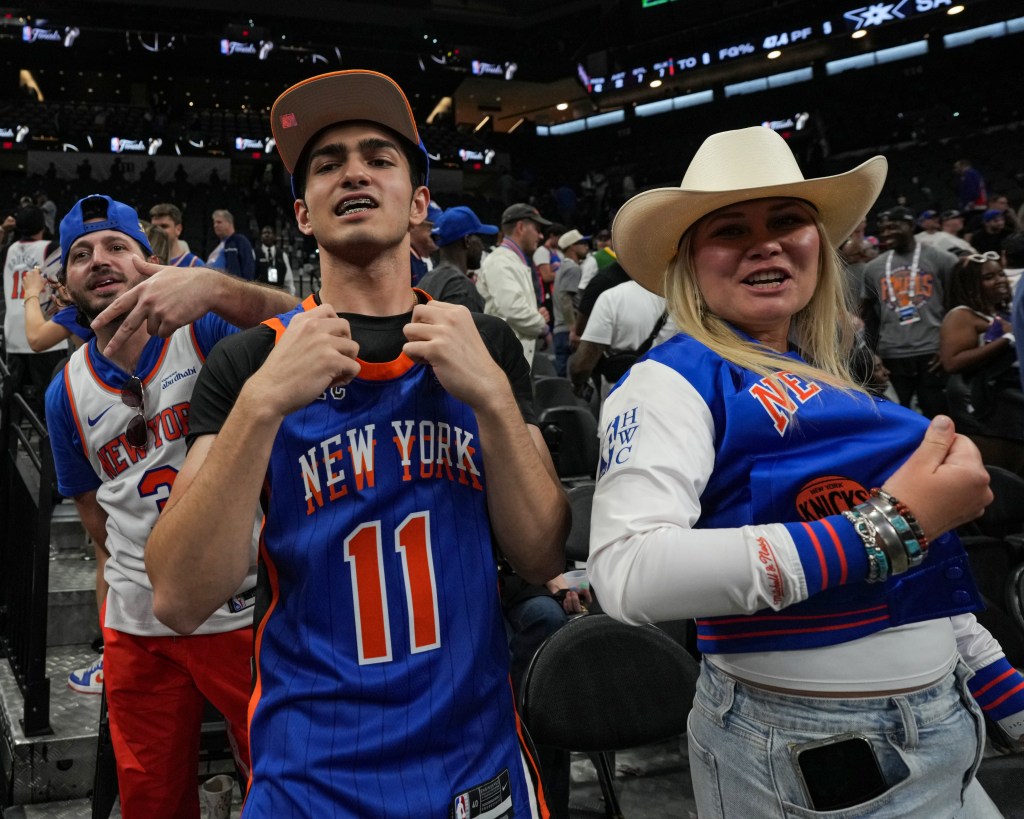 New York Knicks fans cheer at a 2026 NBA Finals game.
