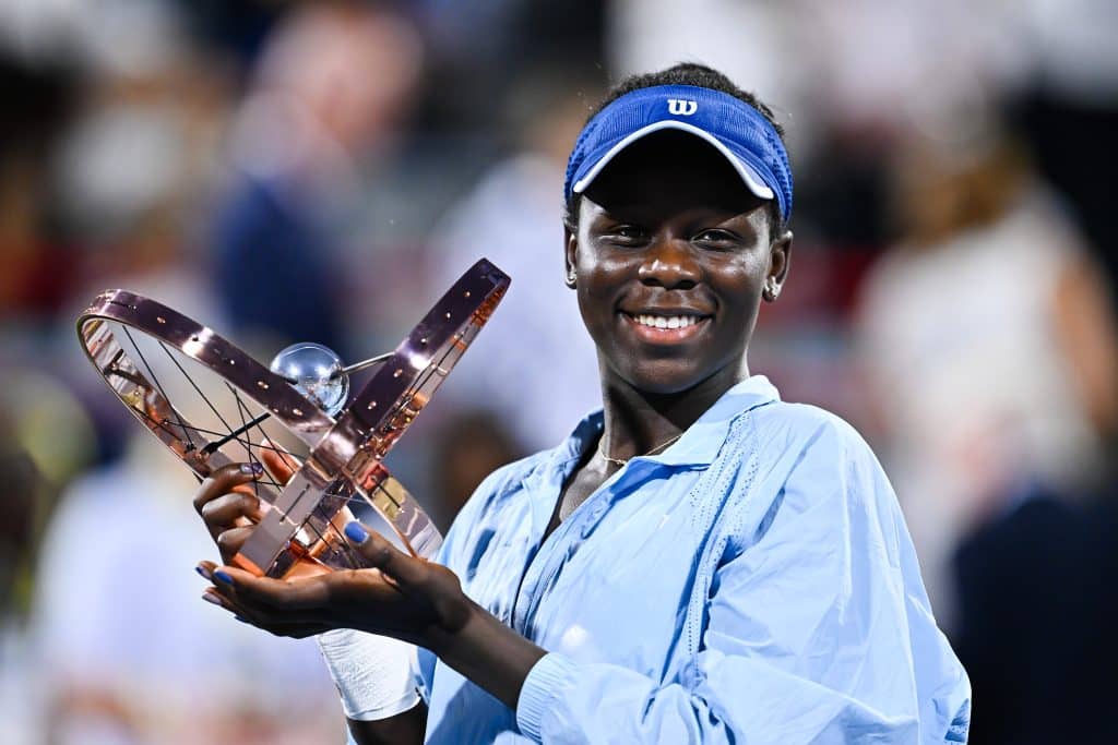 MONTREAL, CANADA - AUGUST 07: Victoria Mboko of Canada celebrates as she holds up the trophy following her victory against Naomi Osaka of Japan during the Women's Singles Final match on day twelve of the WTA 1000 National Bank Open at IGA Stadium on August 7, 2025 in Montreal, Quebec, Canada.