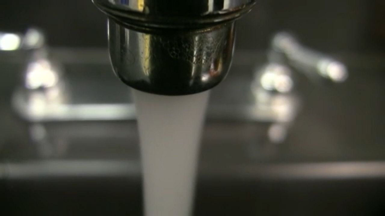 Water coming out of a faucet