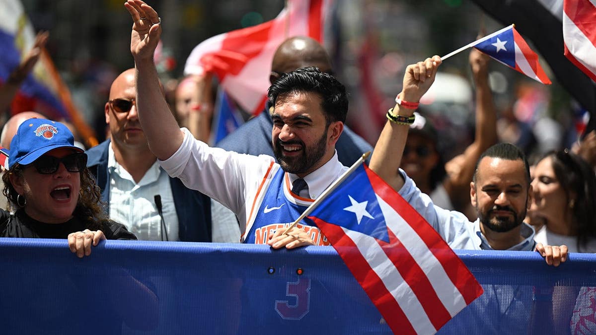 Mayor Zohran Mamdani standing at the National Puerto Rican Day Parade in New York City
