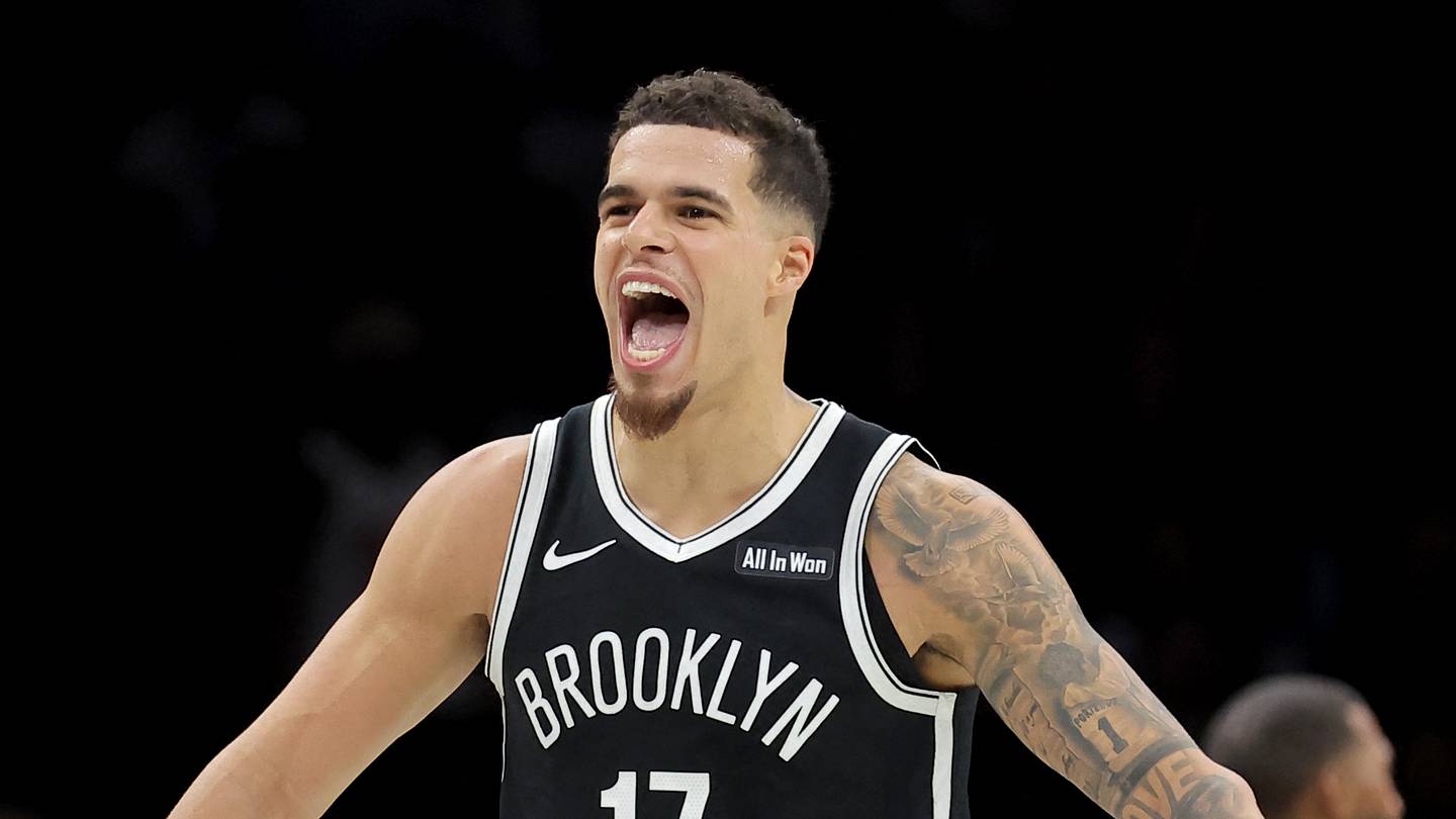 Dec 1, 2025; Brooklyn, New York, USA; Brooklyn Nets forward Michael Porter Jr. (17) reacts with guard Egor Demin (8) during the fourth quarter against the Charlotte Hornets at Barclays Center. Mandatory Credit: Brad Penner-Imagn Images