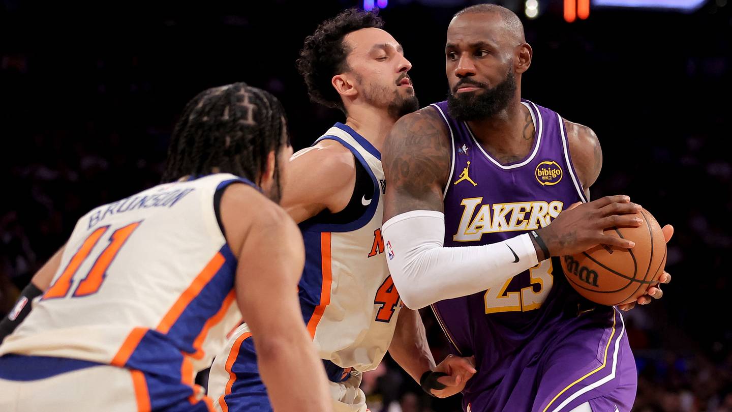 Feb 1, 2026; New York, New York, USA; Los Angeles Lakers forward LeBron James (23) drives to the basket against New York Knicks guards Jalen Brunson (11) and Landry Shamet (44) during the third quarter at Madison Square Garden. Mandatory Credit: Brad Penner-Imagn Images