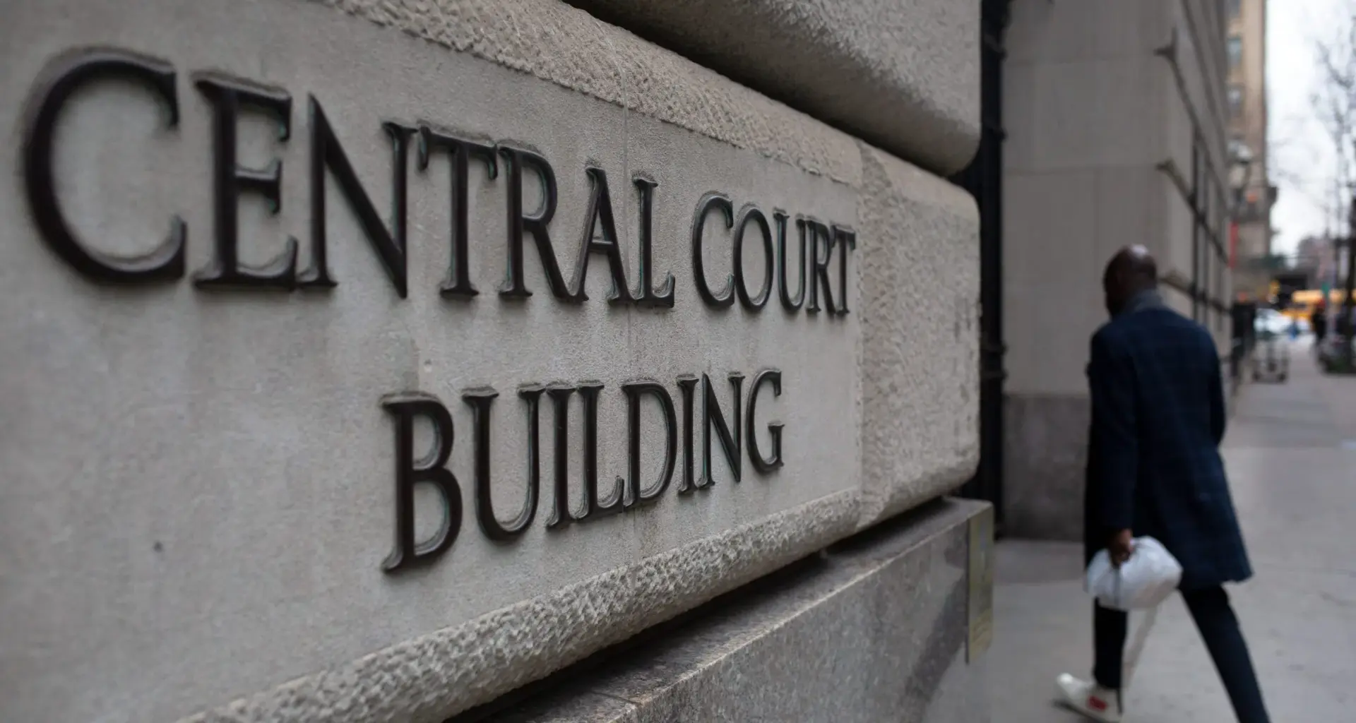 A person walks into Brooklyn Criminal Court, March 27, 2024. Credit: Ben Fractenberg/THE CITY