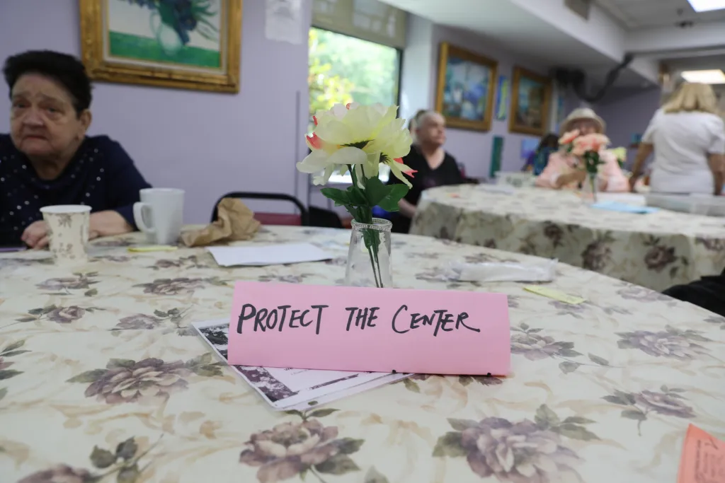"Protect The Center" read a small sign at a Ehi Ezer Ocean Parkway Senior Center lunch table