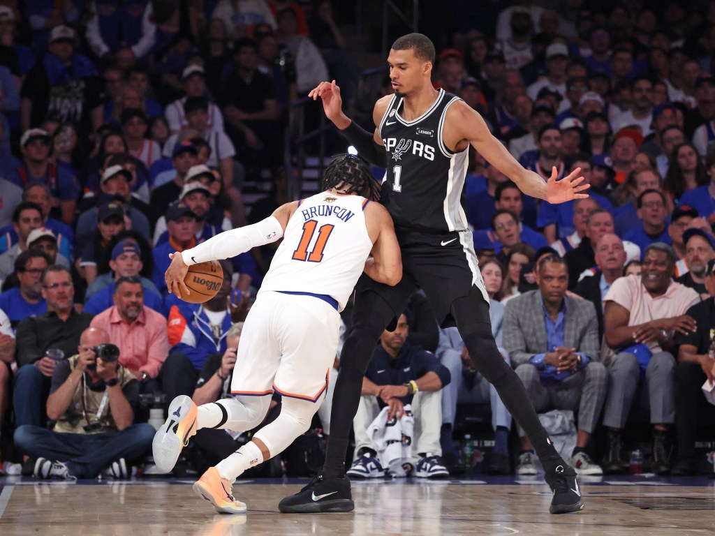 San Antonio Spurs forward Victor Wembanyama #1 defends against New York Knicks guard Jalen Brunson #11 during the second quarter.