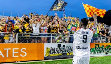 Albert Dikwa celebrates with fans in the Supporters' Section after the Pittsburgh Riverhounds' 1-0 win over Indy Eleven on June 13, 2026 at F.N.B. Stadium in Pittsburgh. (Photo: Chris Cowger/Riverhounds SC)