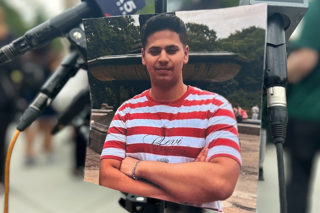 A picture of tourist Romanch Mahajan was placed at a Central Park vigil following his death during a carriage ride.
