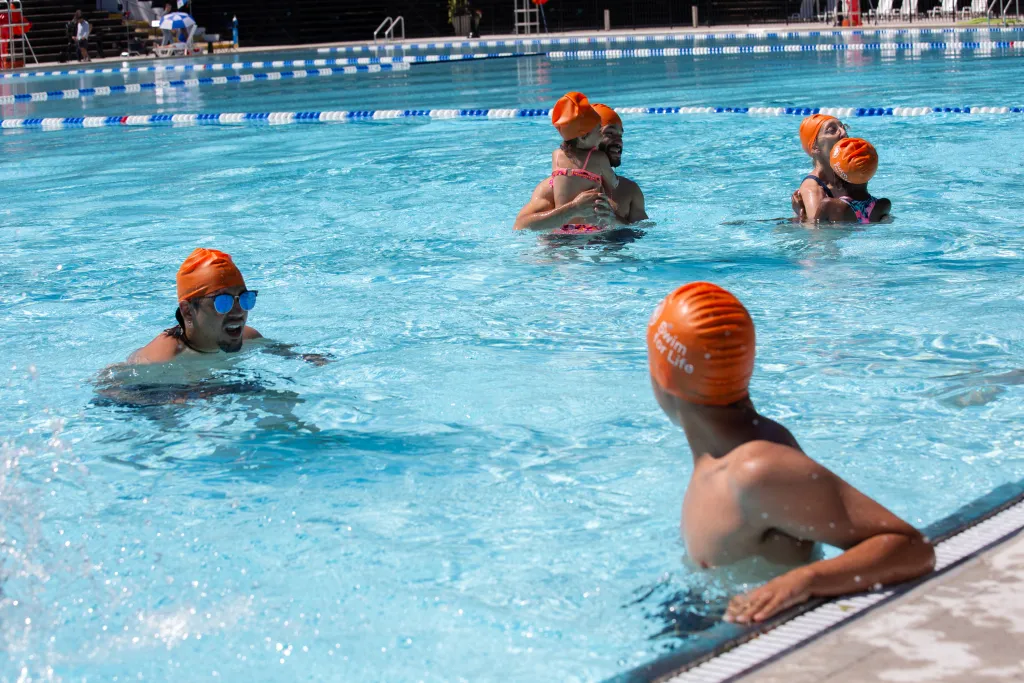 Swimmers cool off in Astoria Pool during the start of the summer season.