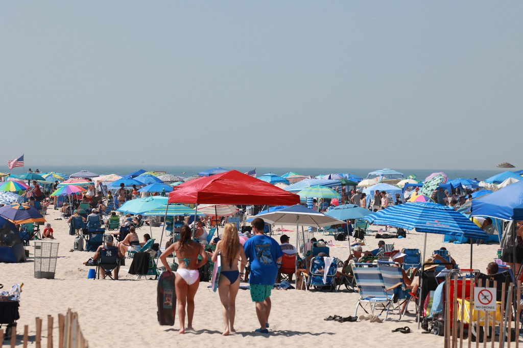 Spectators cooling off in the Atlantic Ocean during practice for the FourLeaf Air Show at Jones Beach.