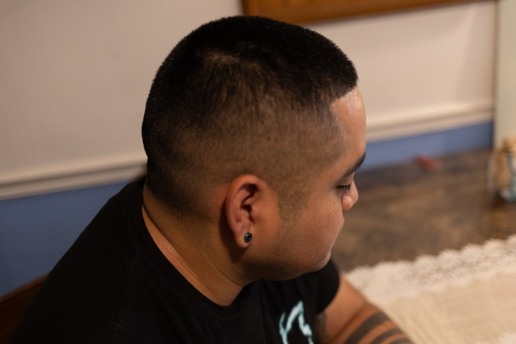 Steven sits in his Flushing apartment where NYPD officers arrested him while he was having a schizophrenic episode.