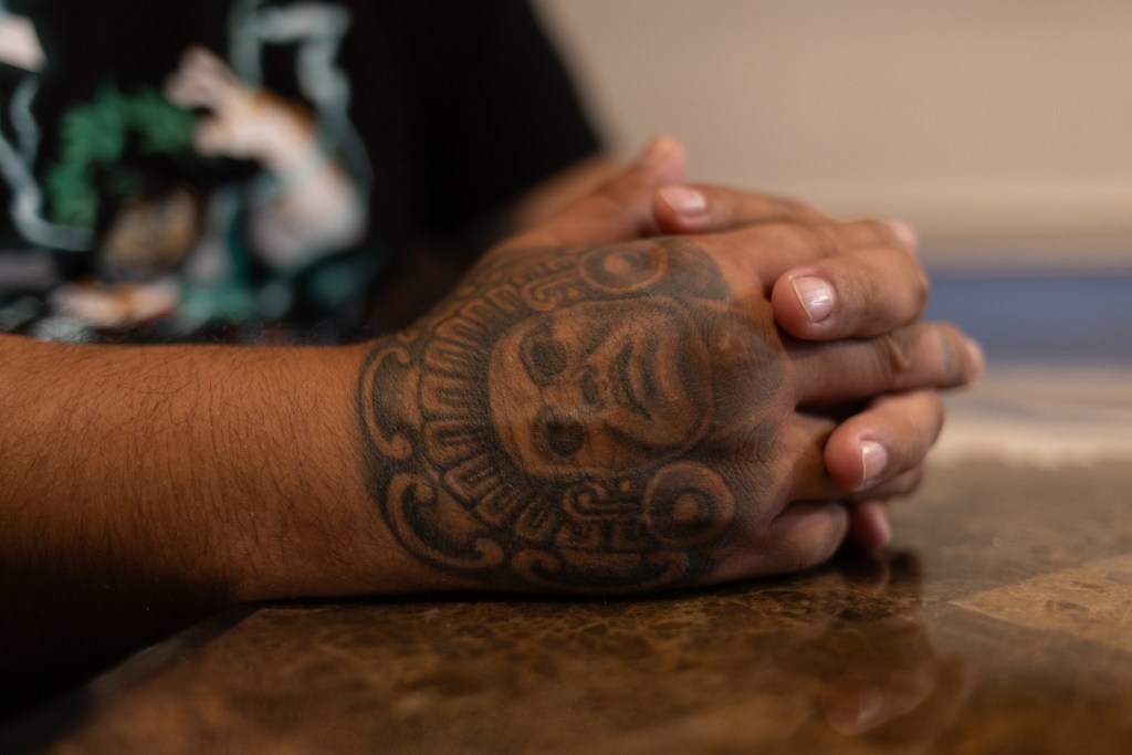 Steven sits in his Flushing apartment where NYPD officers arrested him while he was having a schizophrenic episode.