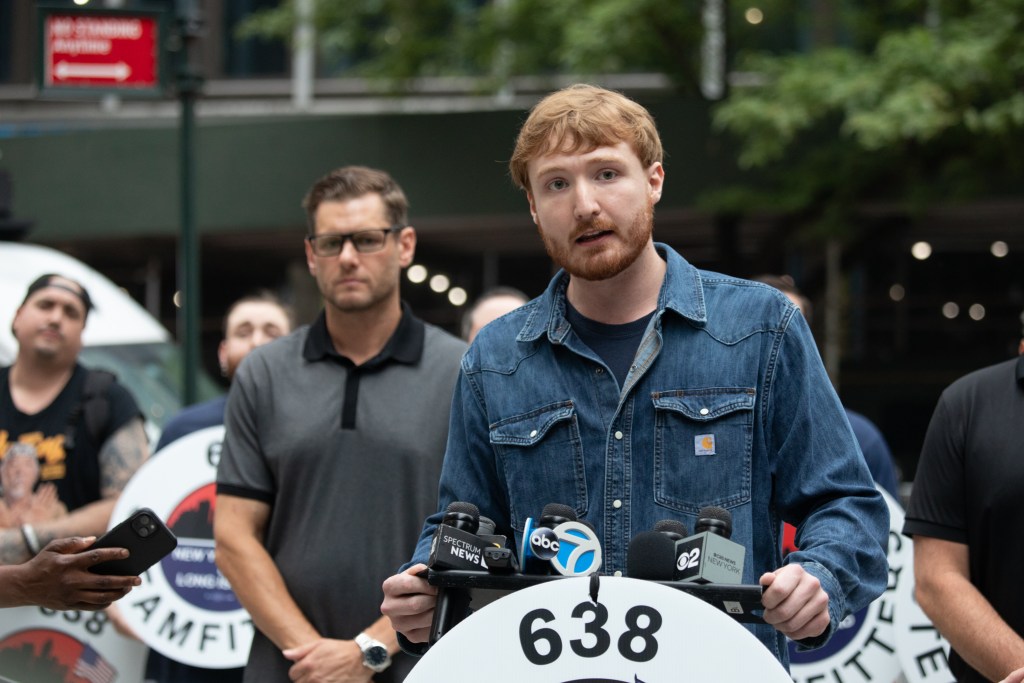 Steamfitters union shop steward Sean Dow speaks during a press conference outside the Pfizer building on East 42nd Street after he saw unstable beams and helped get the building evacuated