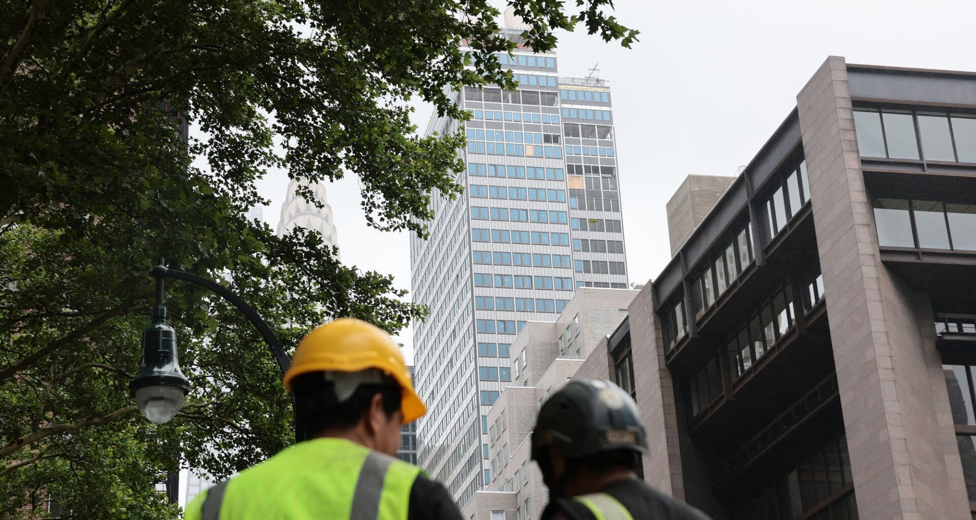 Above, a view of the former Pfizer headquarters, where columns buckled, in New York City on July 7. After fears of a collapse, the building has since been deemed stable.