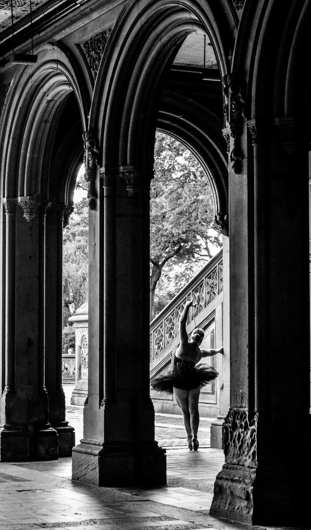 10 - A ballerina strikes a dramatic pose at the famous arches of Bethesda Arcade.