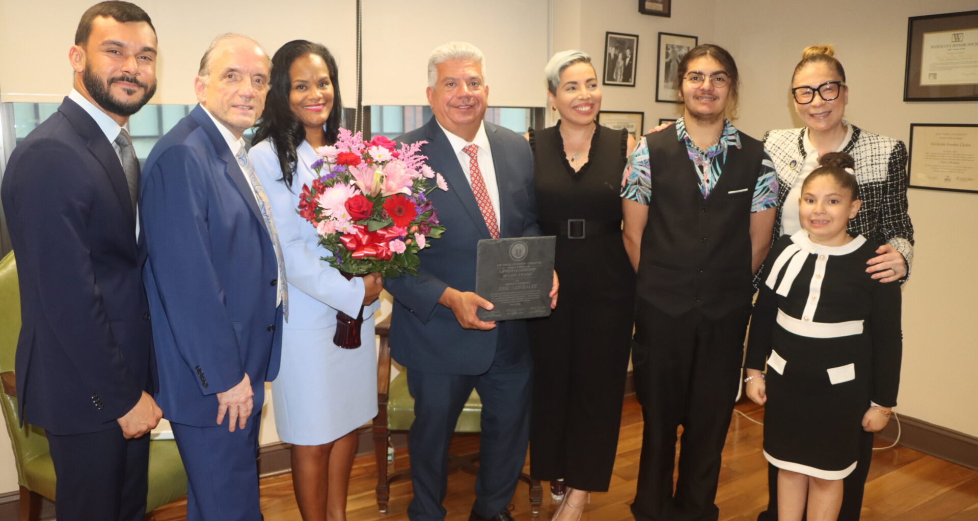 From left: Alejandro Colon-Cedeno, Hon. Patrick Hayes Torres, Hon. Dagmar Plaza-Gonzalez, Brooklyn District Attorney Eric Gonzalez, Kathleen Garcia-Aracena, Nikolai Garcia, Lillian Mosley and Rose Garcia. Photo: Mario Belluomo/Brooklyn Eagle