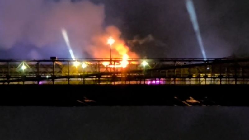 Flames rise from Brooklyn Bridge during July Fourth fireworks