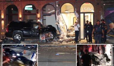 Wild video shows two cars almost hit pedestrian as smash into Brooklyn building in suspected road rage clash