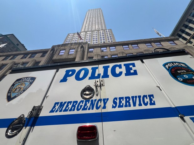 Police are pictured outside the Empire State Building Wednesday after two people climbed its top spire. (Barry Williams / New York Daily News)