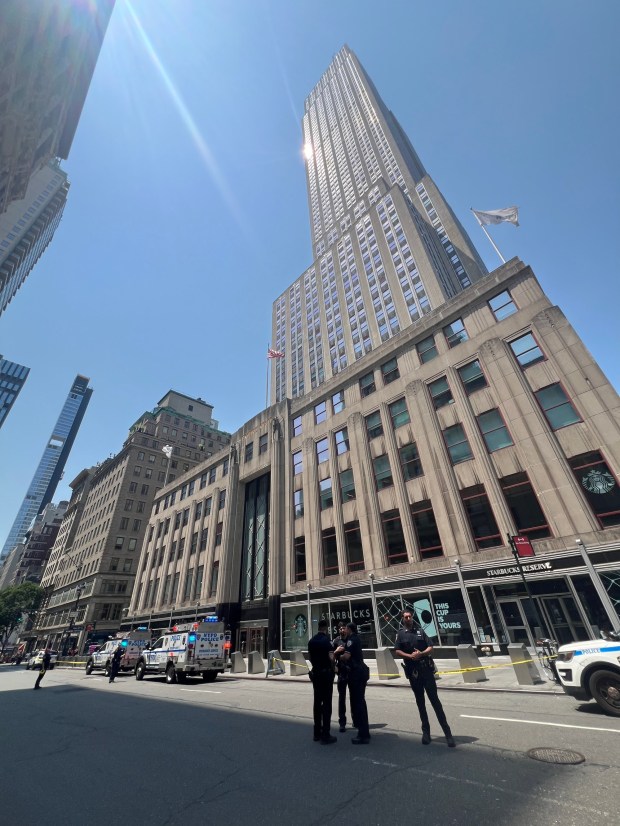 Police are pictured outside the Empire State Building Wednesday after two people climbed its top spire. (Barry Williams / New York Daily News)