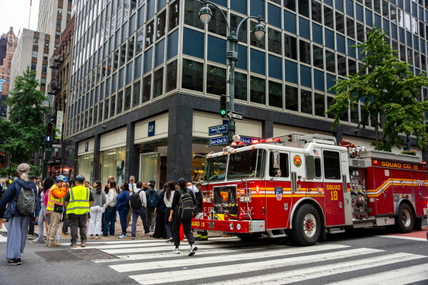 A firetruck is parked at the intersection of 3rd Avenue and East 42nd Street after buildings in the area were evacuated, Tuesday, July 7, 2026, in New York. (AP Photo/Angelina Katsanis)