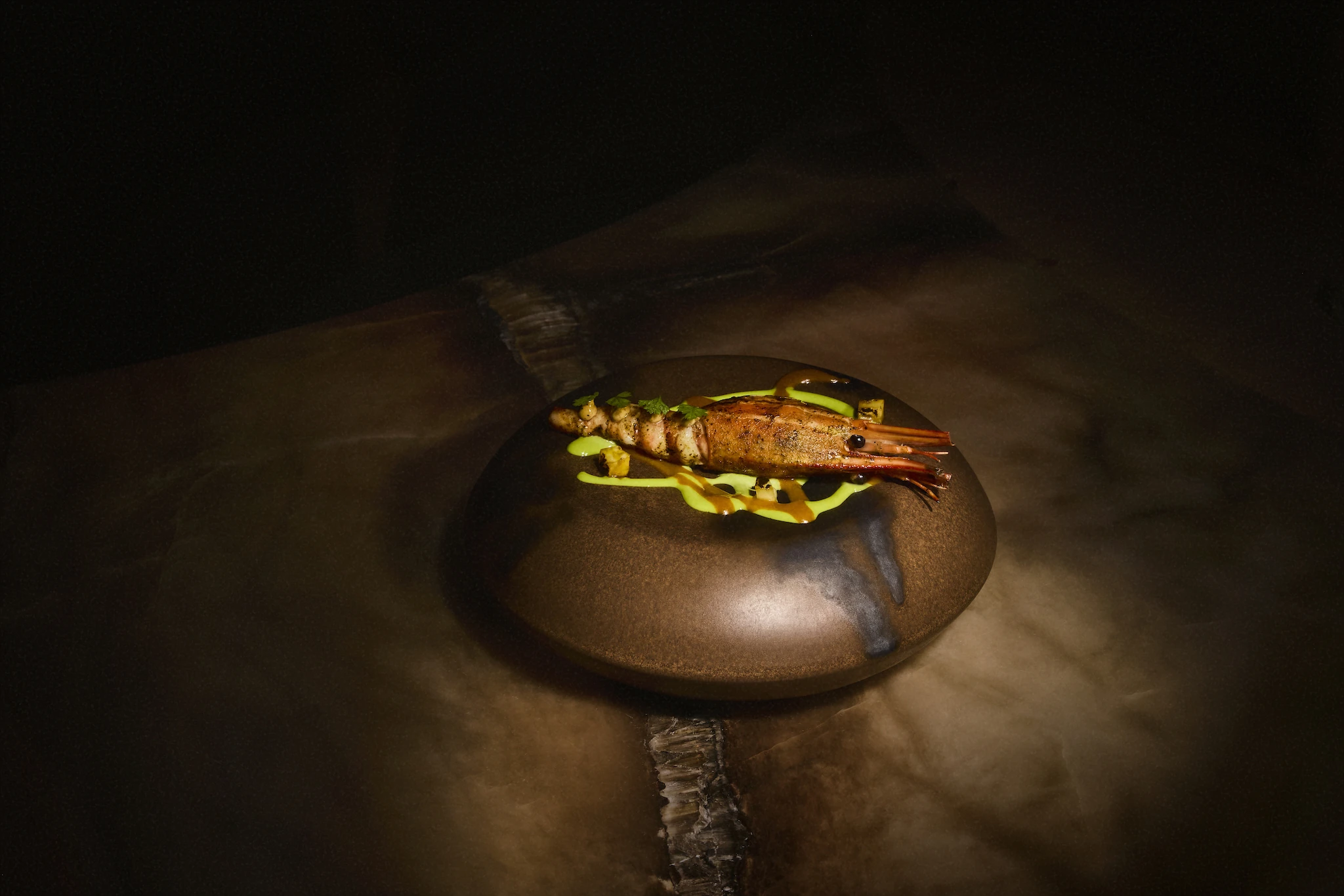A shrimp dish on a brown plate