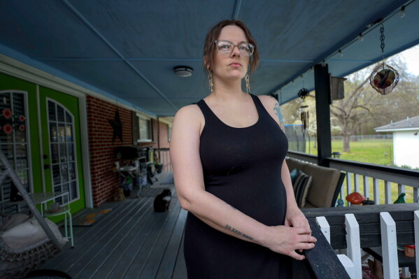 Stormy Bost stands on her porch in Calhoun, Ga., on March 29, 2026. (Miguel Martinez/Atlanta Journal-Constitution via AP)