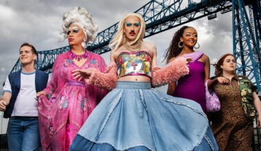 Smoggie Queens still, five individuals walking against a grey cloudy sky