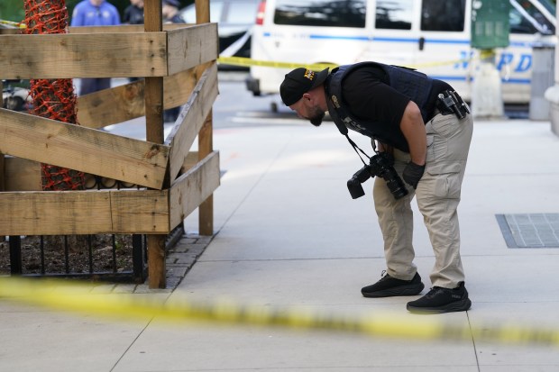 An NYPD officer investigate a stabbing at W. 84th St. and Central Park West in Manhattan on Thursday, July 23, 2026 in New York City. (Barry Williams/ New York Daily News)