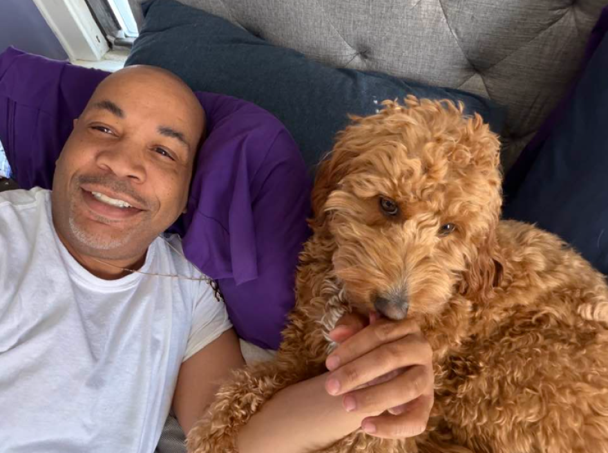 New York Assembly Speaker Carl Heastie and his goldendoodle, Paisley.