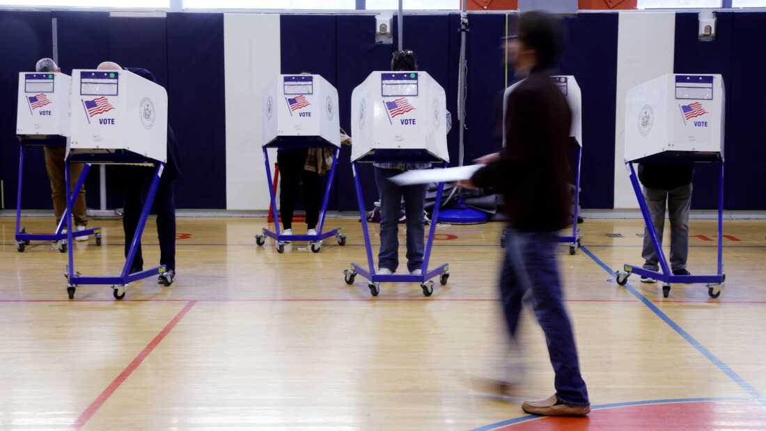 In this file photo from Nov. 4, 2025, people vote at a polling location in New York City. New Yorkers will pick a new mayor on November 4 after an unpredictable race that has drawn attention from far beyond the largest city in the United States, with President Donald Trump branding frontrunner Zohran Mamdani "a communist." Breakout Democratic Party candidate Mamdani, a naturalized Muslim American who represents Queens in the state legislature, leads former governor and sex assault-accused Andrew Cuomo, running as an independent after losing his party's primary contest to Mamdani. (Photo by Leonardo Munoz / AFP) (Photo by LEONARDO MUNOZ/AFP via Getty Images)