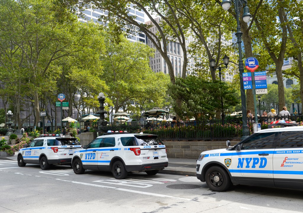 NYPD Critical Response Command (CRC) team vehicles parked outside Bryant Park in Manhattan.
