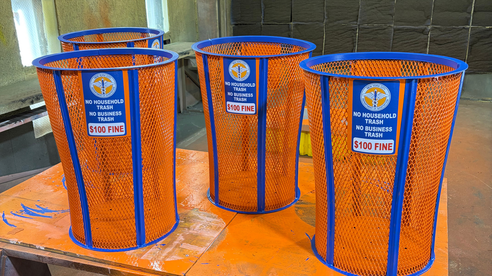 5 people set to win Knicks-themed trash cans from the sanitation department in NYC