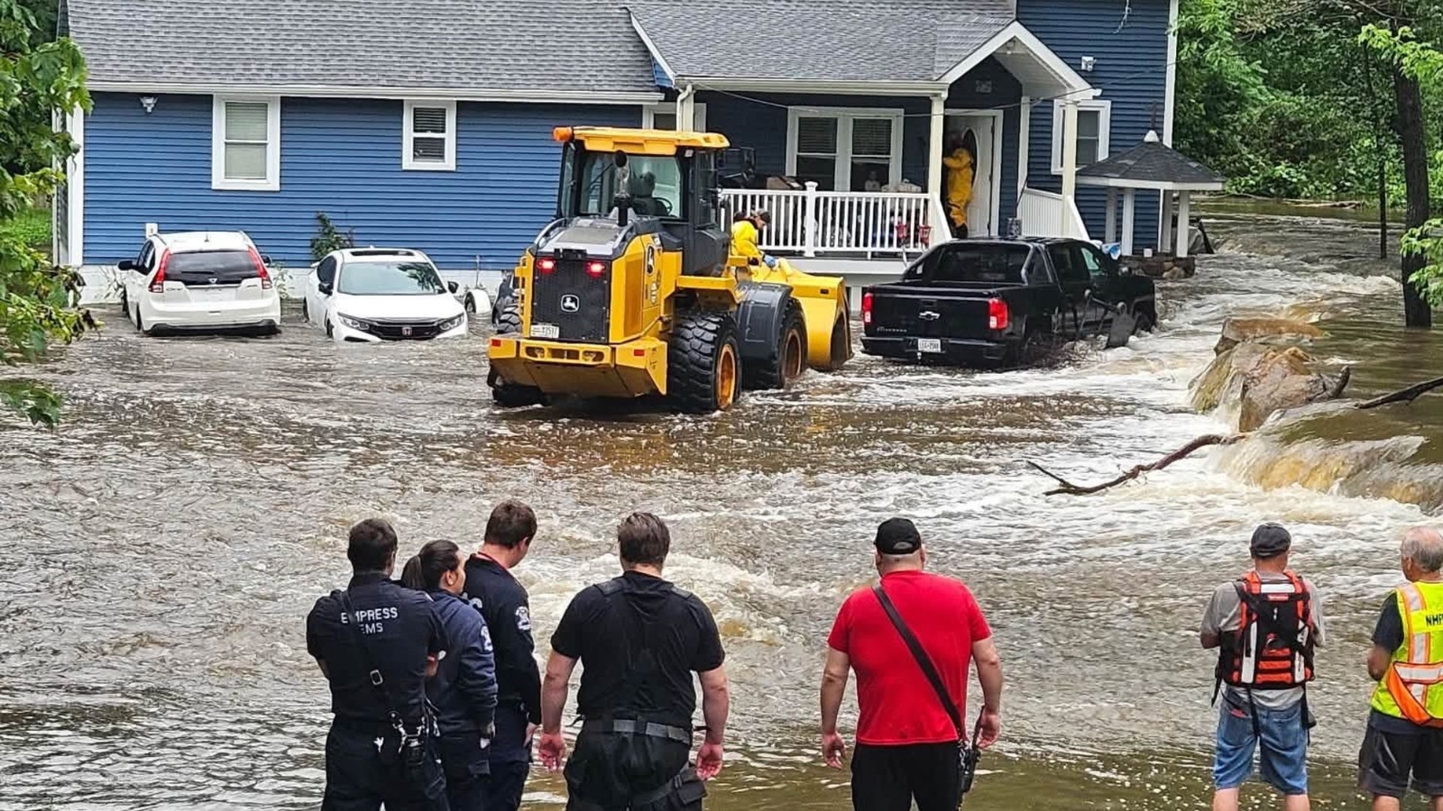 Family rescued from flooded home by firefighters using front-end loader in Philipstown, Putnam County
