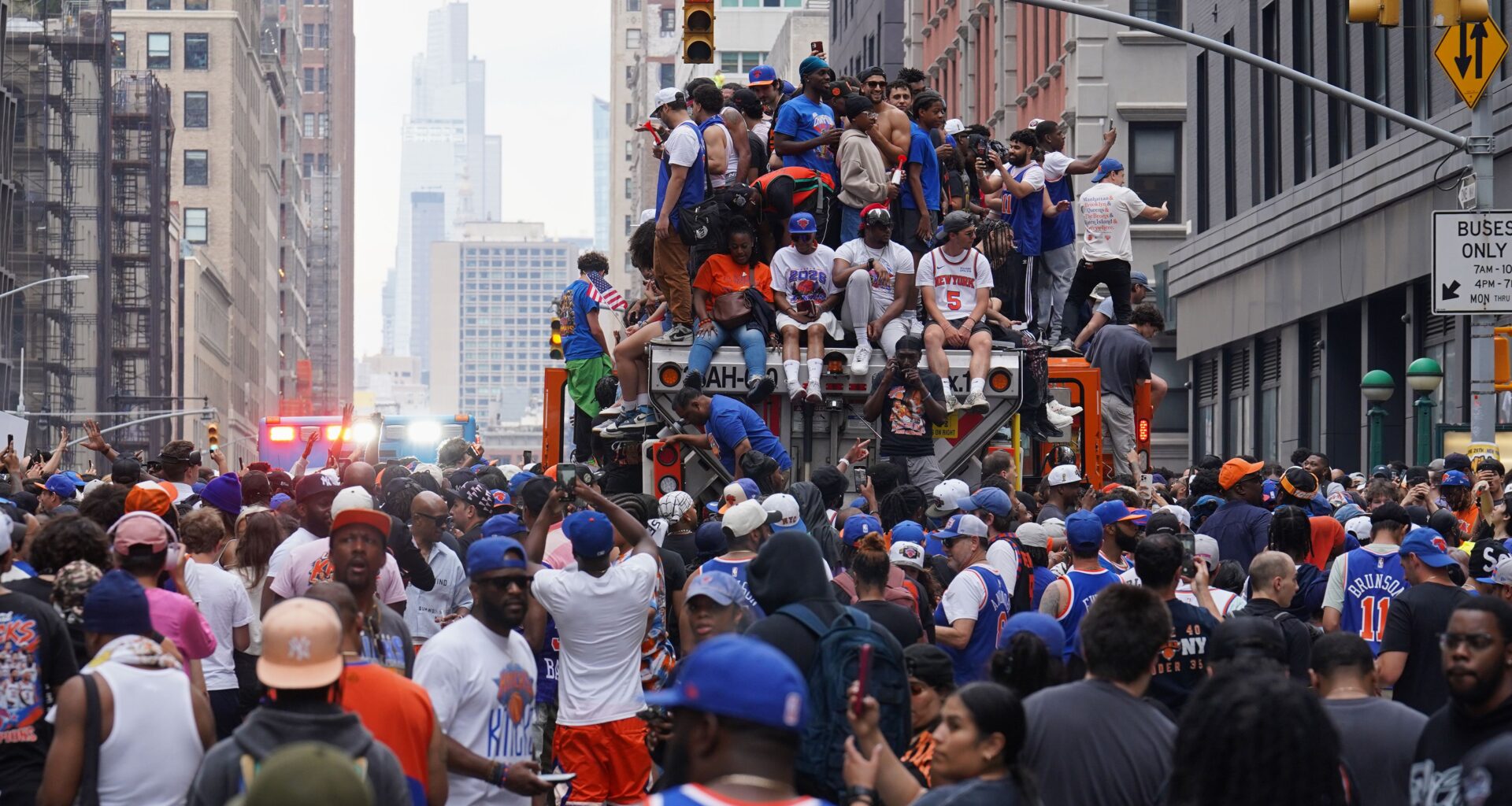 Fans celebrate during the New York Knicks' NBA championship parade Thursday, June 18, 2026, in New York. (AP Photo/Ryan Murphy)