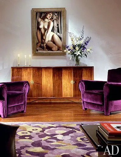 A circa-1930 sideboard by Eugène Printz features one of his signature design motifs—accordion-folded doors. Andromeda, 1929, by Tamara de Lempicka and a pair of late-1930s American club chairs are grouped in another area of the living room.