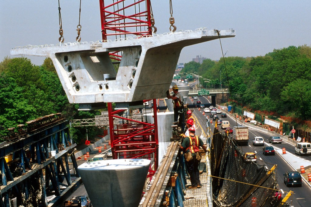 A photo of construction being down with workers. 