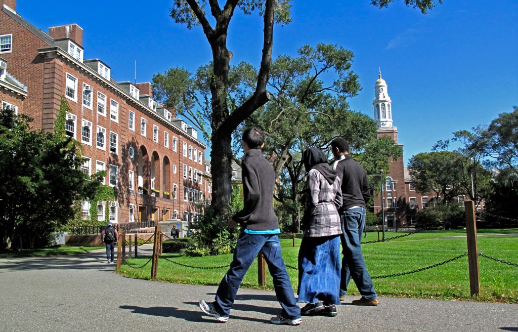 Students walk on campus outside at Brooklyn College. 